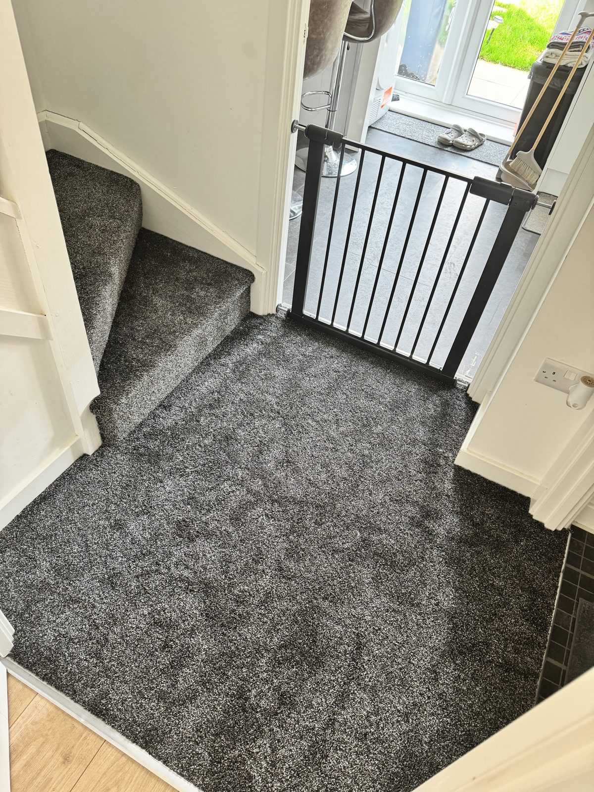 Grey carpet fitted on the stairs and through the hallway