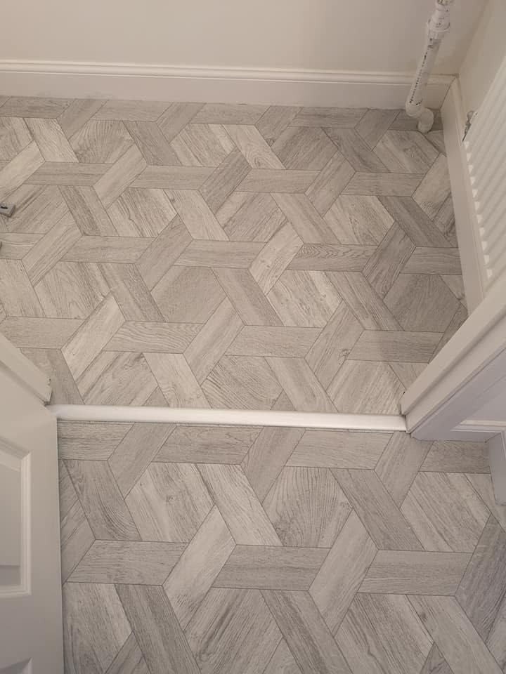 Hexagon-pattern vinyl fitted through a doorway with a neat threshold